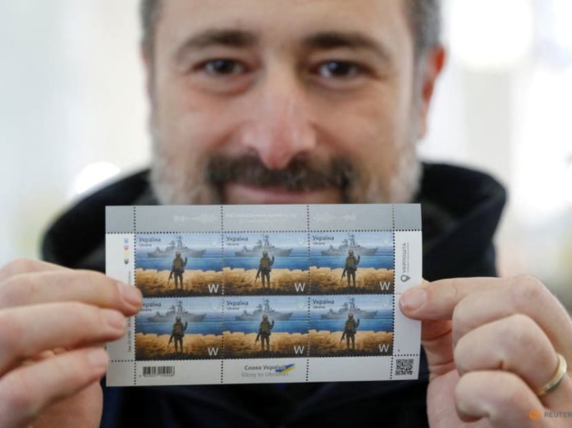CEO of the Ukrainian post Ihor Smilianskyi demonstrates postal stamps showing Ukrainian service member and Russian warship depicting recently damaged guided missile cruiser "Moskva" (Moscow), at company's headquarters in Kyiv, Ukraine April 14, 2022. CEO of the Ukrainian post Ihor Smilianskyi demonstrates postal stamps showing Ukrainian service member and Russian warship depicting recently damaged guided missile cruiser "Moskva" (Moscow), at company's headquarters in Kyiv, Ukraine April 14, 2022.