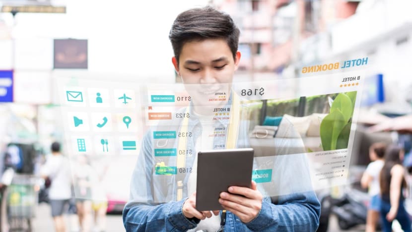 asian tourist using mobile appication technology booking hotel online stock photo