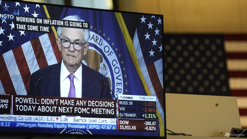 Stocks rise, dollar pares losses after Fed signals more hikes ahead - CNA
