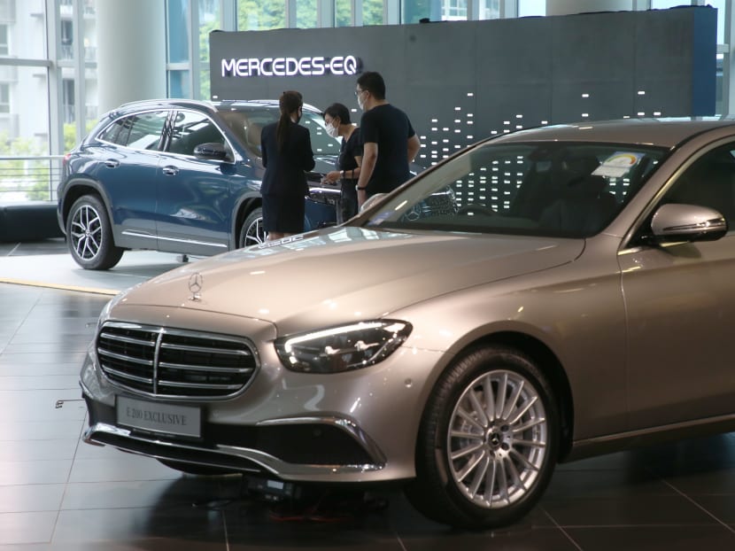 Visitors viewing a car at the C&C Mercedes-Benz Center on April 10, 2022.