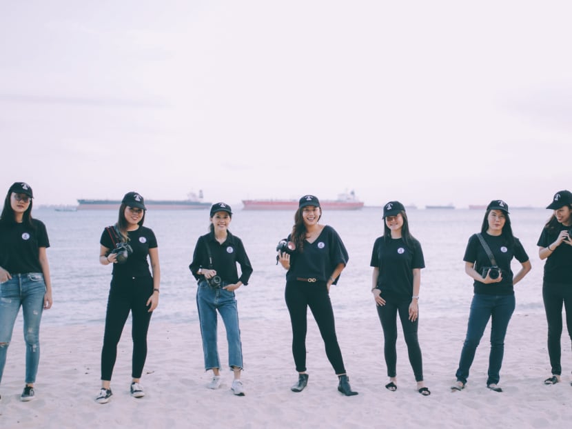 The all-female team of seven photographers at ALP, with founder Annabel Law in the middle.