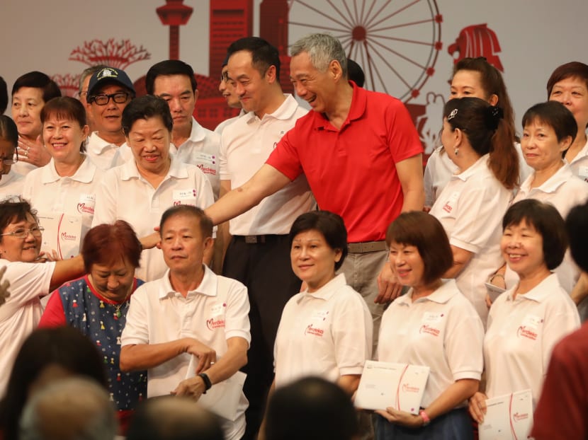 PM Lee received his Merdeka Generation card this morning after handing out Merdeka Generation cards to Ang Mo Kio residents at a Merdeka Generation Appreciation ceremony at the ITE Central.