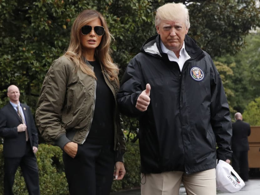President Donald Trump, accompanied by First Lady Melania, giving a thumbs-up at the White House yesterday before they left for Texas to survey the response to Hurricane Harvey. Photo: AP