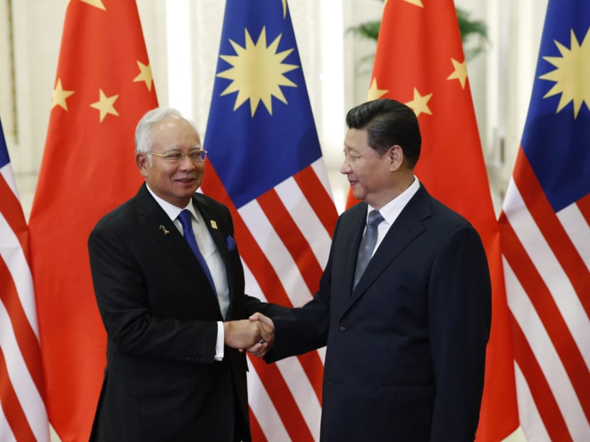 Malaysian PM Najib Razak with Chinese President Xi Jinping at the Asia-Pacific Economic Cooperation meeting in Beijing. Malaysia’s economic ties with China are not new but have been growing. Photo: Reuters