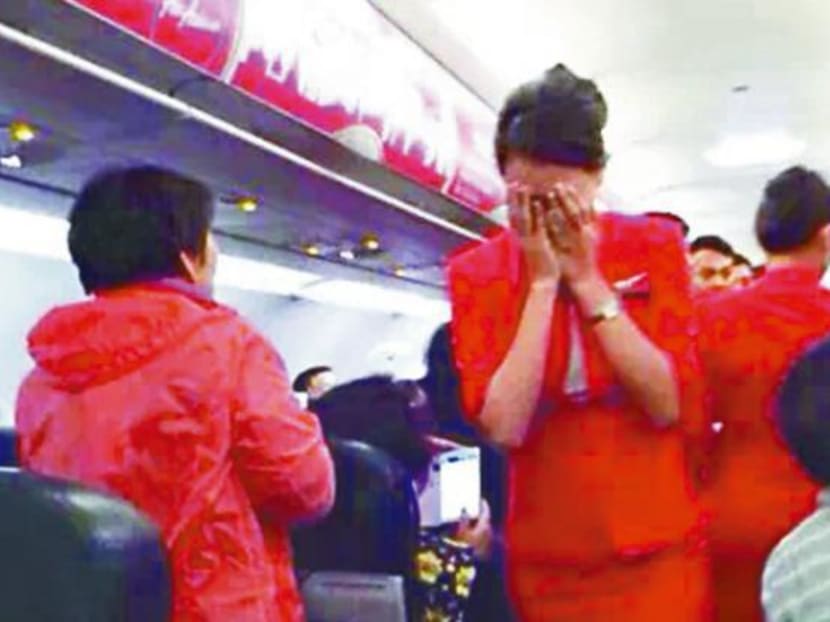 One of the blacklisted names is a Chinese national who poured her instant noodles soaked in hot water onto an AirAsia flight attendant. Photo: Weibo.com