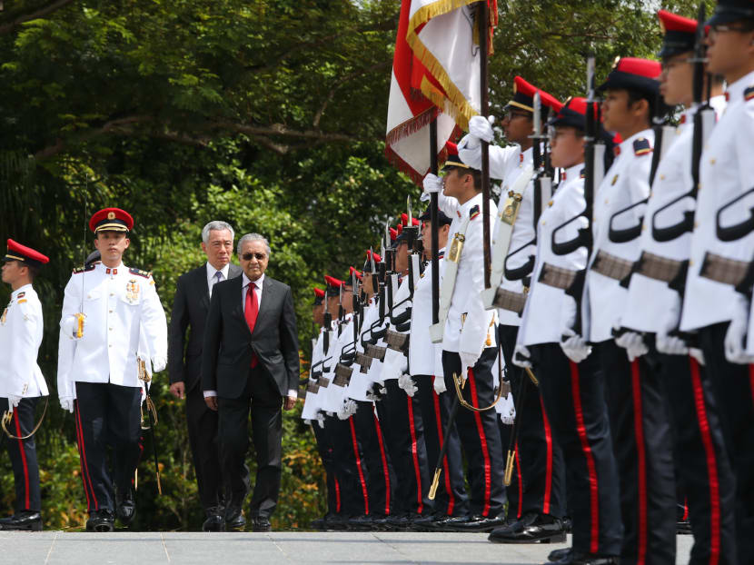 Malaysia's Prime Minister Dr Mahathir Mohamad attends a welcoming ceremony with Prime Minister Lee Hsien Loong at the Istana on November 12, 2018.