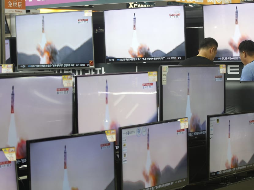 TV screens show file footage of North Korea's ballistic missile that the North claimed to have launched from underwater, at the Yongsan Electronic store in Seoul, South Korea, Wednesday, Aug. 24, 2016. Photo: AP