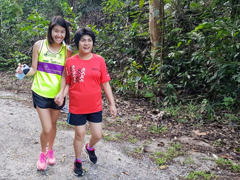 The writer (left) volunteering as a running guide at Runninghour, a running club that strives to integrate people with special needs into society and raise awareness of their conditions. The writer (left) volunteering as a running guide at Runninghour, a running club that strives to integrate people with special needs into society and raise awareness of their conditions.