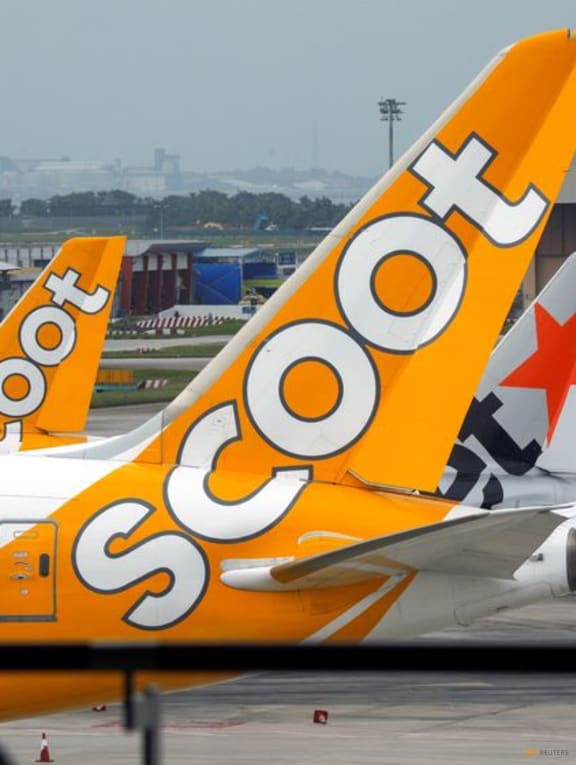 Scoot, Jetstar and Singapore Airlines planes sit on the tarmac at Singapore's Changi Airport, Singapore on 18 Jan, 2021. Scoot, Jetstar and Singapore Airlines planes sit on the tarmac at Singapore's Changi Airport, Singapore on 18 Jan, 2021.