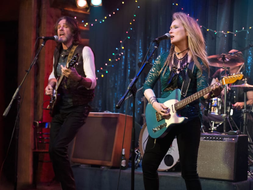 This photo provided by courtesy of Sony Pictures shows, Rick Springfield, left, as Greg and Meryl Streep, as Ricki, performing at the Flash at the Salt Well in TriStar Pictures' Ricki and the Flash. Photo: AP