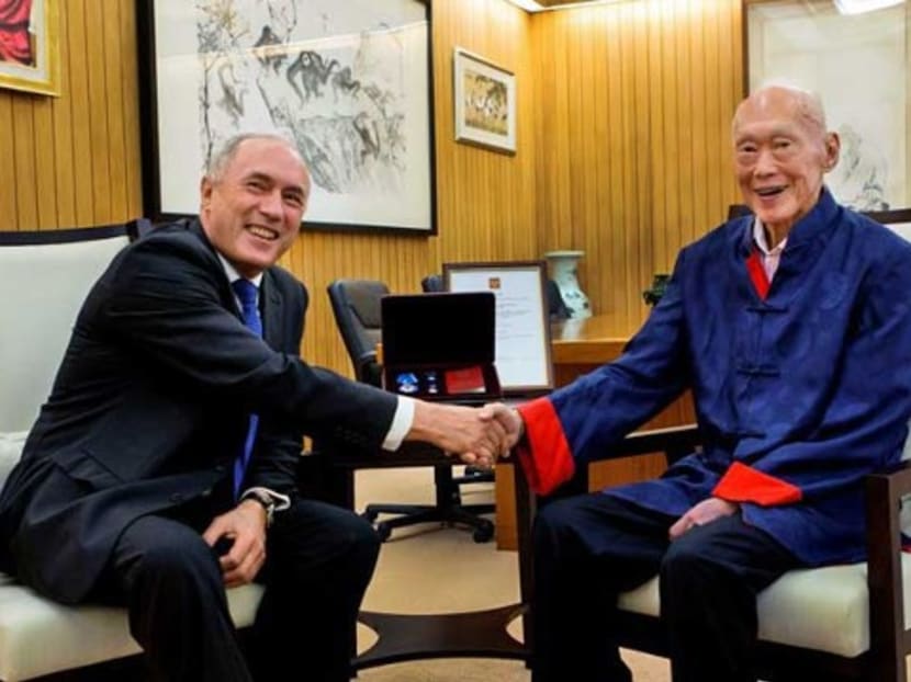 Ambassador of the Russian Federation His Excellency Leonid Moiseev (left) presents the Order of Honour to Mr Lee Kuan Yew. Photo: Singapore's Ministry of Communications and Information