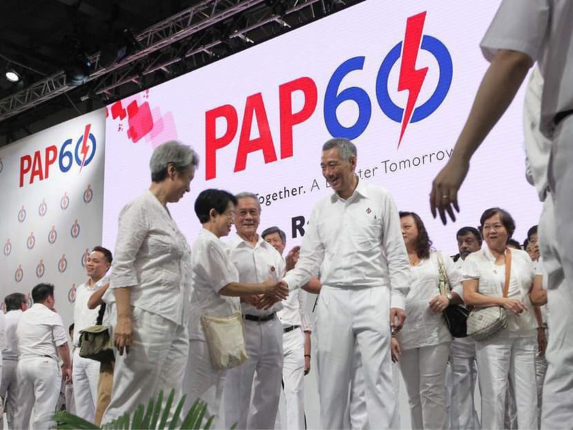Prime Minister Lee Hsien Loong, who is also Secretary-General of the PAP, interacts with members on stage at the PAP60 Party Rally held at the Singapore Expo on Dec 7, 2014. Photo: Ooi Boon Keong