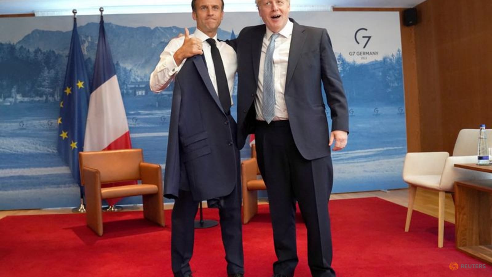Pats on back, all smiles as Macron, Johnson appear to bury hatchet for G7 thumbnail