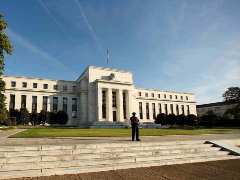 A police officer keeps watch in front of the United States Federal Reserve building in Washington.