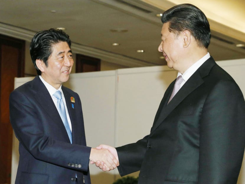 Gallery: Xi, Abe’s first meeting in five months signals thaw in ties