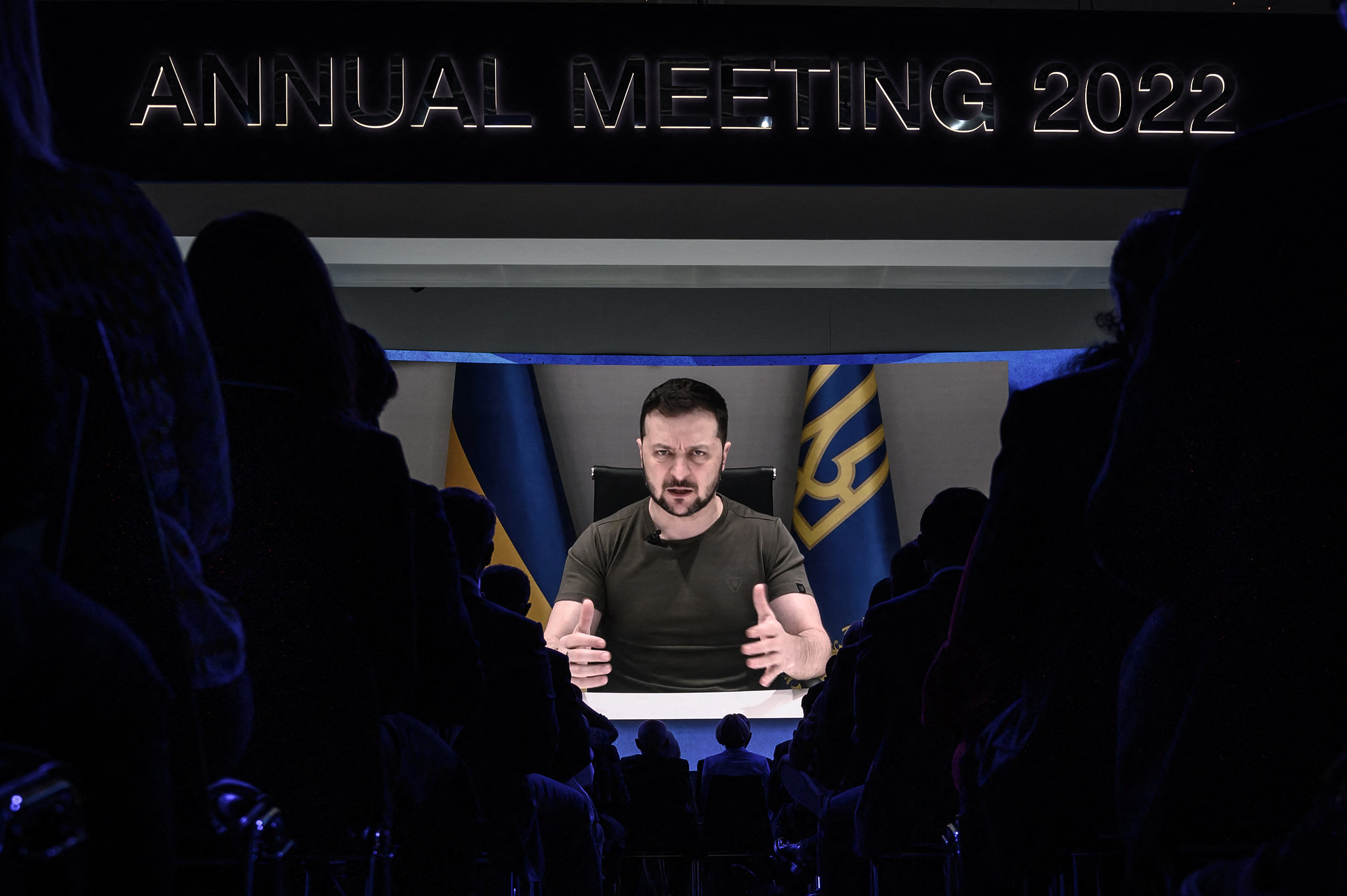 Ukrainia's President Volodymyr Zelensky appears on a giant screen during his address by video conference as part of the World Economic Forum (WEF) annual meeting in Davos on May 23, 2022. Ukrainia's President Volodymyr Zelensky appears on a giant screen during his address by video conference as part of the World Economic Forum (WEF) annual meeting in Davos on May 23, 2022.