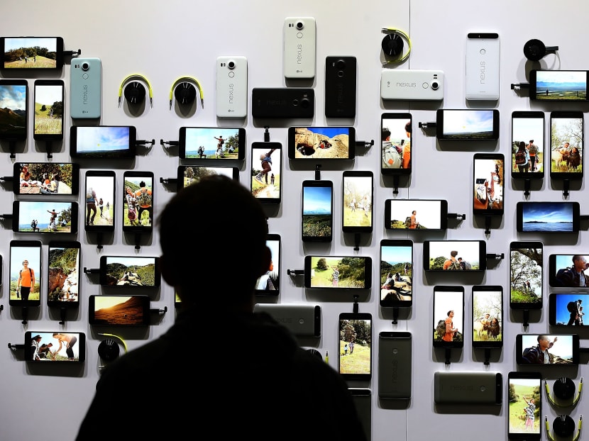 An attendee looks at a display of new Google devices during a Google media event on Sept 29, 2015 in San Francisco, California. Photo: AFP