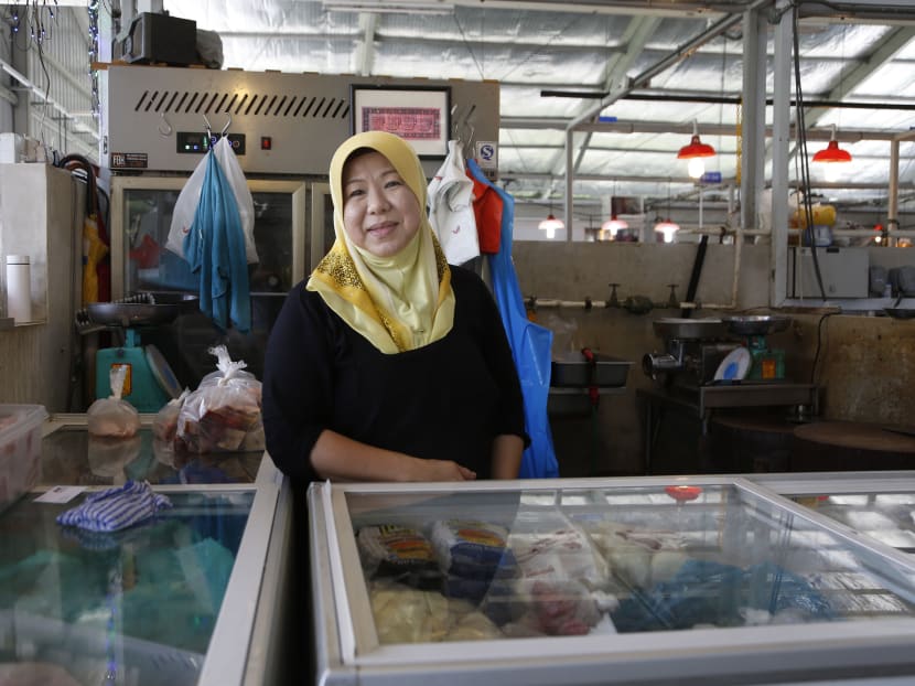 While earnings have dropped for Madam Norsiah Abdullah, who runs the Zul and Nor Meat Store at the Jurong West temporary market, she is grateful many customers continue to support her business. Photo: Raj Nadarajan/TODAY