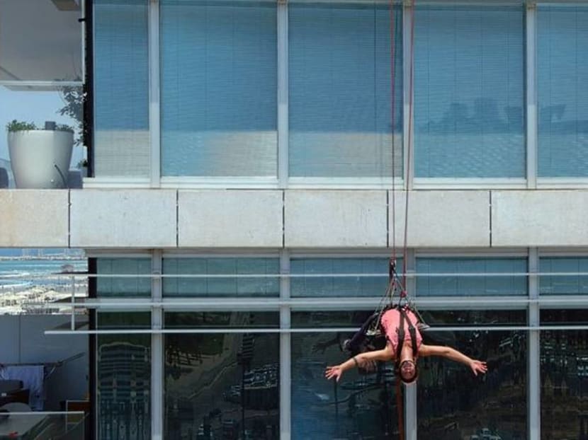 Squeegee selfies: Tel Aviv tower-washer is rising TikTok star Squeegee selfies: Tel Aviv tower-washer is rising TikTok star