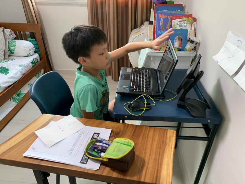 Parents play IT role as system glitches mar first day of home-based learning for primary schools Parents play IT role as system glitches mar first day of home-based learning for primary schools