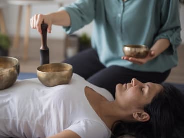 Can a sound bath wash away your worries? Are there health benefits to listening to gongs?