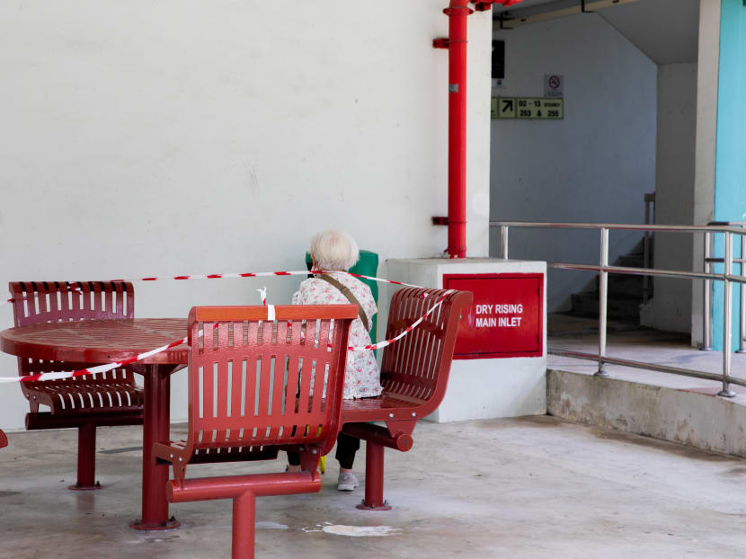 An elderly woman is seen sitting down, catching her breath at a void deck on April 29, 2020.