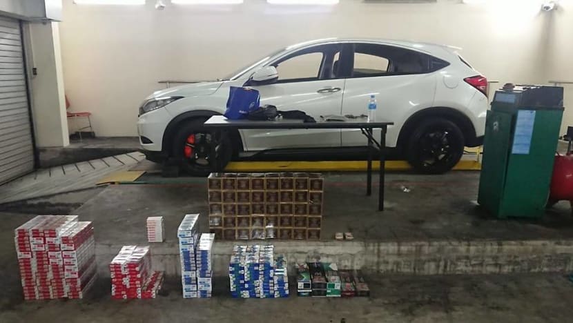 Two people caught smuggling cigarettes, e-cigarettes at Tuas Checkpoint Two people caught smuggling cigarettes, e-cigarettes at Tuas Checkpoint