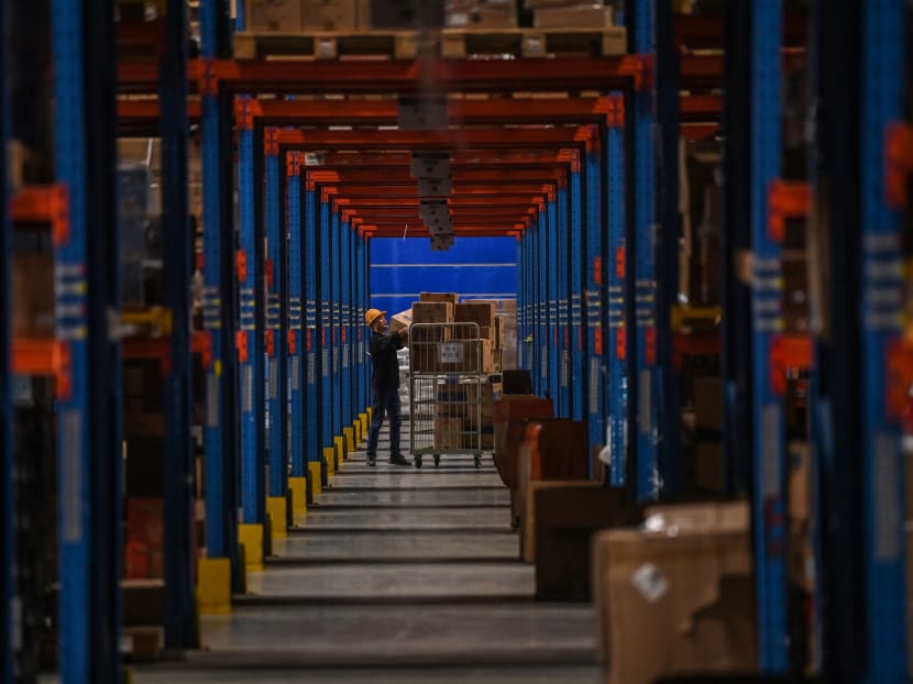 In this picture taken on Nov 6, 2020, an employee works in the warehouse of Cainiao Smart Logistics Network, the logistics affiliate of e-commerce giant Alibaba, in Wuxi, China's eastern Jiangsu province, ahead of Singles' Day, also known as the Double 11 shopping festival. In this picture taken on Nov 6, 2020, an employee works in the warehouse of Cainiao Smart Logistics Network, the logistics affiliate of e-commerce giant Alibaba, in Wuxi, China's eastern Jiangsu province, ahead of Singles' Day, also known as the Double 11 shopping festival.