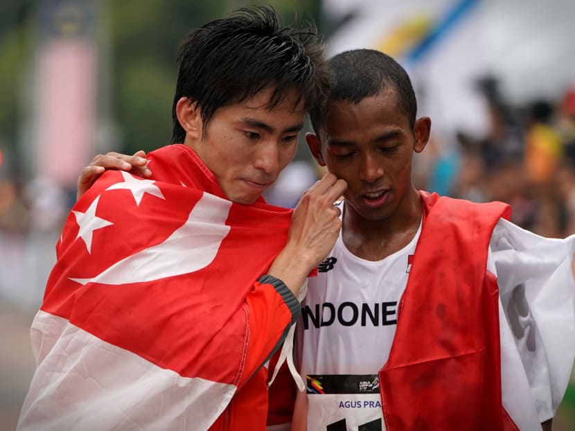 Soh Rui Yong and Agus Prayogo after the marathon. Photo: Jason Quah/TODAY