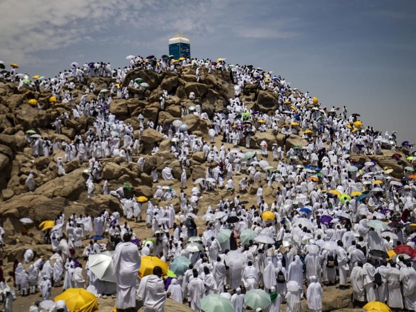 Muslim pilgrims gather atop Mount Arafat, also known as Jabal al-Rahma (Mount of Mercy), southeast of the holy city of Mecca, during the climax of the haj pilgrimage, on July 8, 2022.