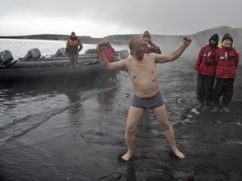 Tourists enjoy the hot springs of the crater lake of Deception Island, Antarctica, on March 06, 2016. Photo: AFP