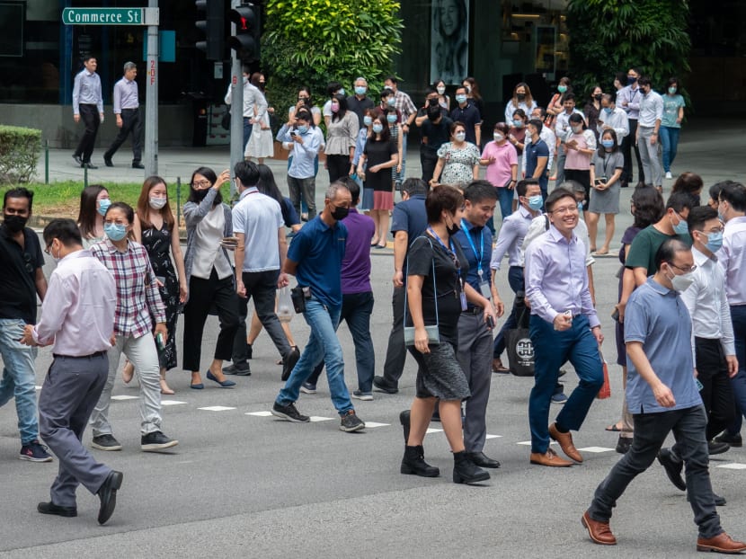 Pedestrians at a traffic crossing in the Central Business District on April 26, 2022.