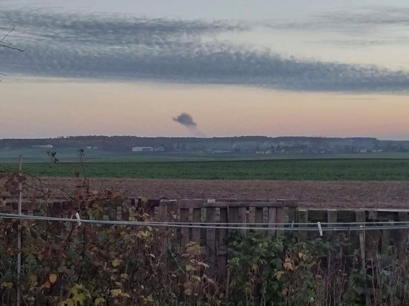 Smoke rises in the distance, amid reports of two explosions, seen from Nowosiolki, Poland, near the border with Ukraine Nov 15, 2022.