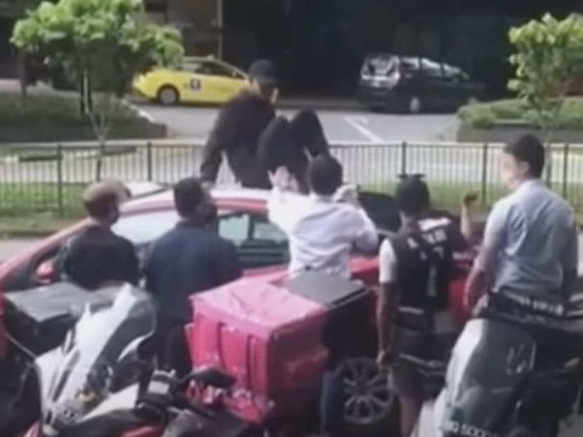 Muhammad Shafiee Abdul Hakim sitting on a taxi, in footage taken from a video of the incident posted online. Muhammad Shafiee Abdul Hakim sitting on a taxi, in footage taken from a video of the incident posted online.