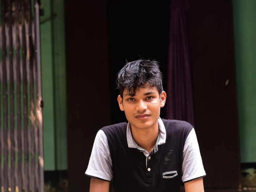 This photo taken on May 27, 2017 shows teenager Khaled Hossain posing for a photo during an interview with AFP at his house in Beanibazer in northeastern Bangladesh's Sylhet District. More than 100 people were squeezed into the tiny boat, all having paid thousands of dollars to embark on the perilous journey from Libya to Italy. Photo: AFP