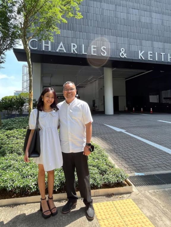 (Left) Zoe Gabriel and her father visit Charles & Keith's headquarters in Singapore on Thursday (Jan 12). (Right) Zoe unboxes a barbeque and steamboat grill as part of a TikTok video in partnership with PowerPac and two hawker stalls.