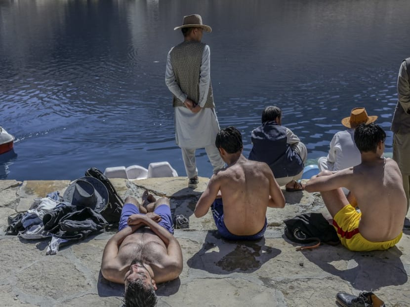 People enjoy their day at the Band e-Amir lake in the Bamiyan Province on Oct 4, 2021.