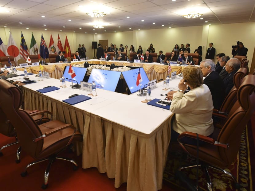 An empty seat, foreground, allocated for Canada's Prime Minister Justin Trudeau is seen during a meeting for the TPP in Vietnam in Nov. A Japanese government official said that till today, Japan is not sure what Canada wants from the trade pact. Photo: AP