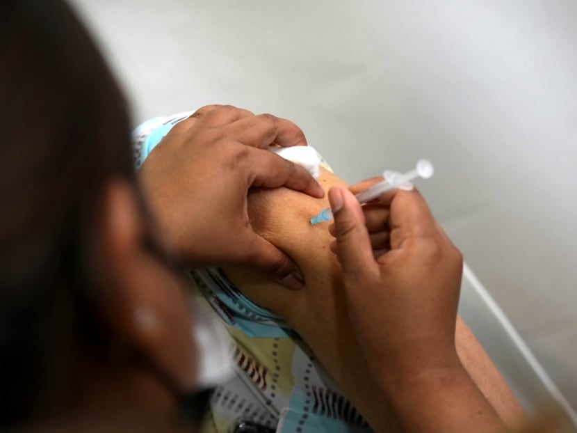 A senior is injected with the Pfizer-BioNTech Covid-19 vaccine at Tanjong Pagar Community Centre on Jan 27, 2021.
