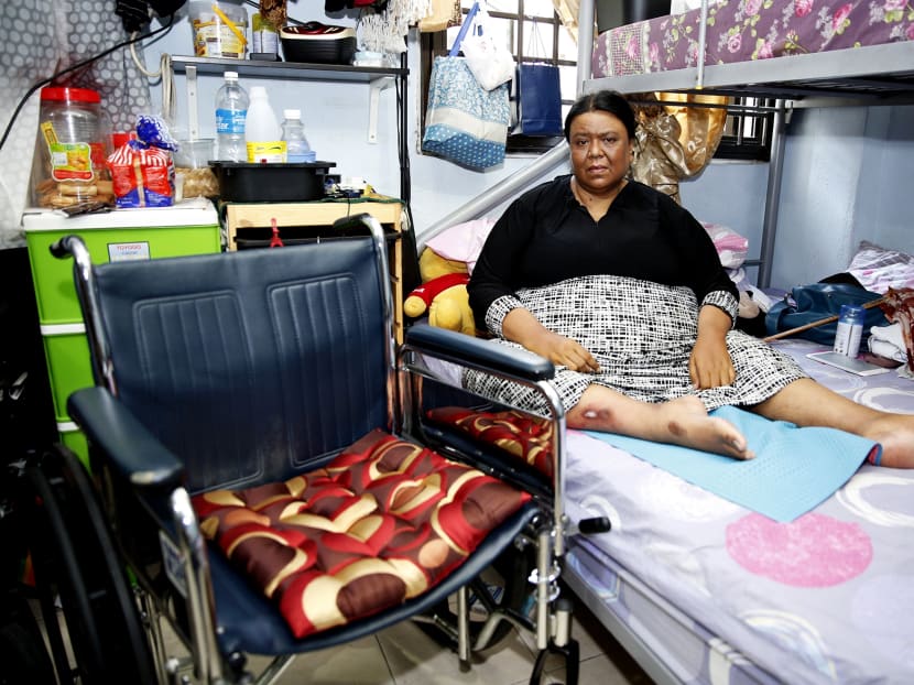 Ms Puspawati Abdul Razat, who is wheelchairbound, in her one-room flat in
Telok Blangah Crescent. She was dissuaded by the couple from calling an ambulance for Daniel, but managed to do so with her niece’s help. Photo: Damien Teo/TODAY