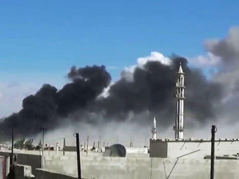 In this image from a video provided by Homs Media Centre, smoke rises after airstrikes by Russian military jets in Talbiseh in the Homs province of Syria on Wednesday. PHOTO: HOMS MEDIA CENTRE VIA AP