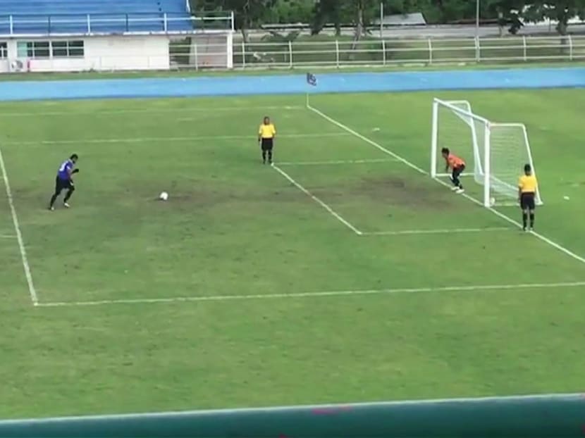 A Thai goalkeeper was left red-faced after sprinting from his goaline to celebrate a penalty hitting the crossbar in a shoot-out — only to watch the ball spectacularly spin back into the empty net. Photo: AFP
