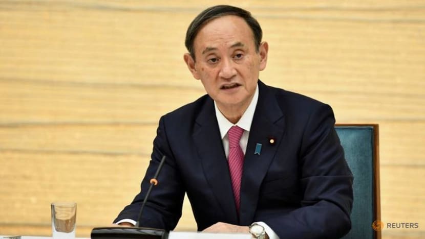 Japan's PM Suga says he is determined to hold Olympics this summer Japan's PM Suga says he is determined to hold Olympics this summer