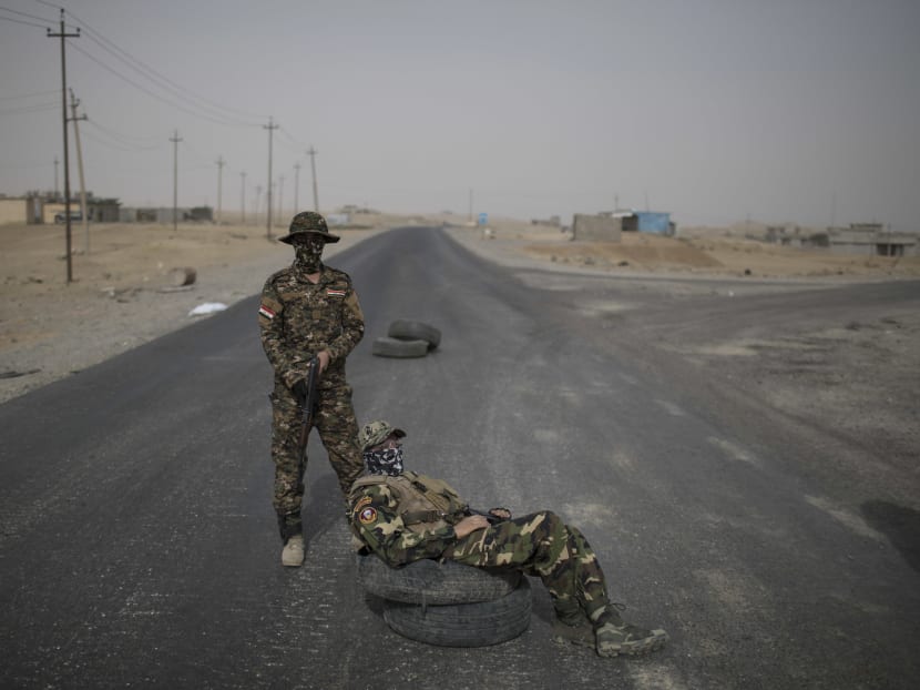 Iraqi army soldiers at the last government-controlled checkpoint south of Mosul. Photo: AP