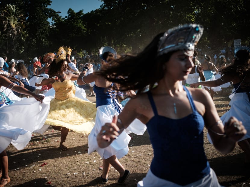 Revellers of street carnival group Tambores de Olokun, perform during a pre-carnival street party at Flamengo Park in Rio de Janeiro. Photo: AFP