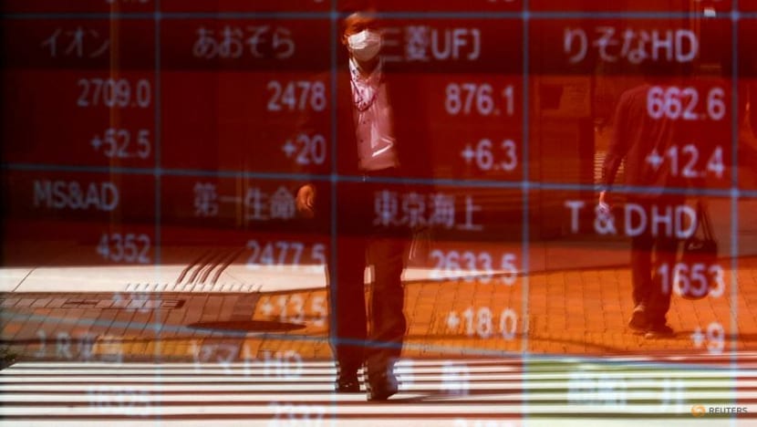 Asia stocks gain; US futures slip after Netflix, Tesla earnings