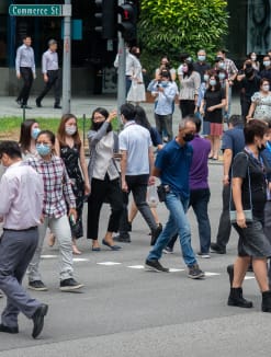Pedestrians at a traffic crossing in the Central Business District on April 26, 2022.
