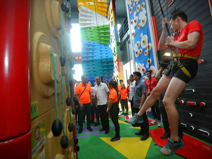 Home Affairs Minister K Shanmugam tours HomeTeamNS' newest and fifth clubhouse in Tampines on Feb 13, 2017, which features Singapore's first indoor climbing park, Clip 'n Climb. Photo: Nuria Ling/TODAY