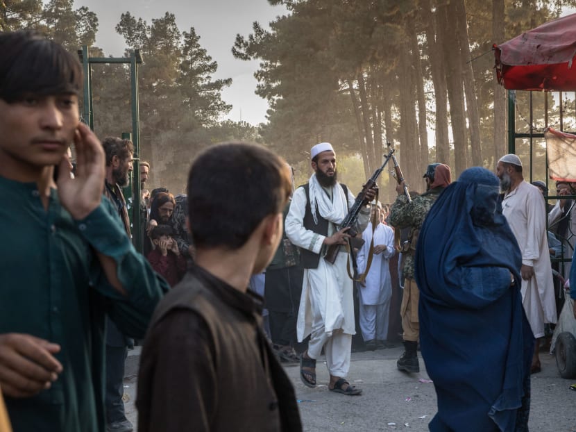 The Taliban maintaining order after a distribution of food in a park in Kabul, Afghanistan, on Sept 24, 2021.