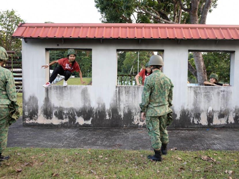 Women’s Boot Camp participants during the Standard Obstacle Course at Maju Camp in Clementi on Feb 11, 2023. 